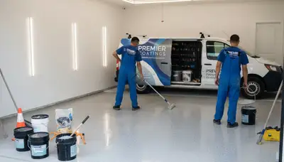 Epoxy garage floor coating application by Albany NY painting contractors for durable winter protection
