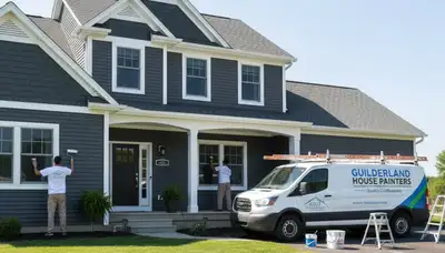 Professional house painters working on residential exterior in Albany, NY